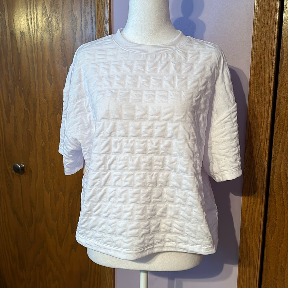 A set of two A New Day women’s size medium white and black short sleeved shirts.